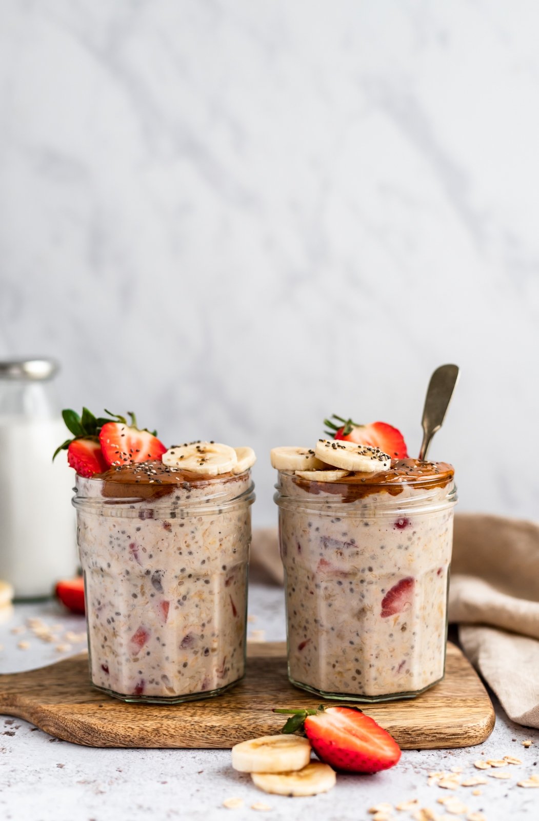almond butter, strawberry and banana overnight oats in two jars