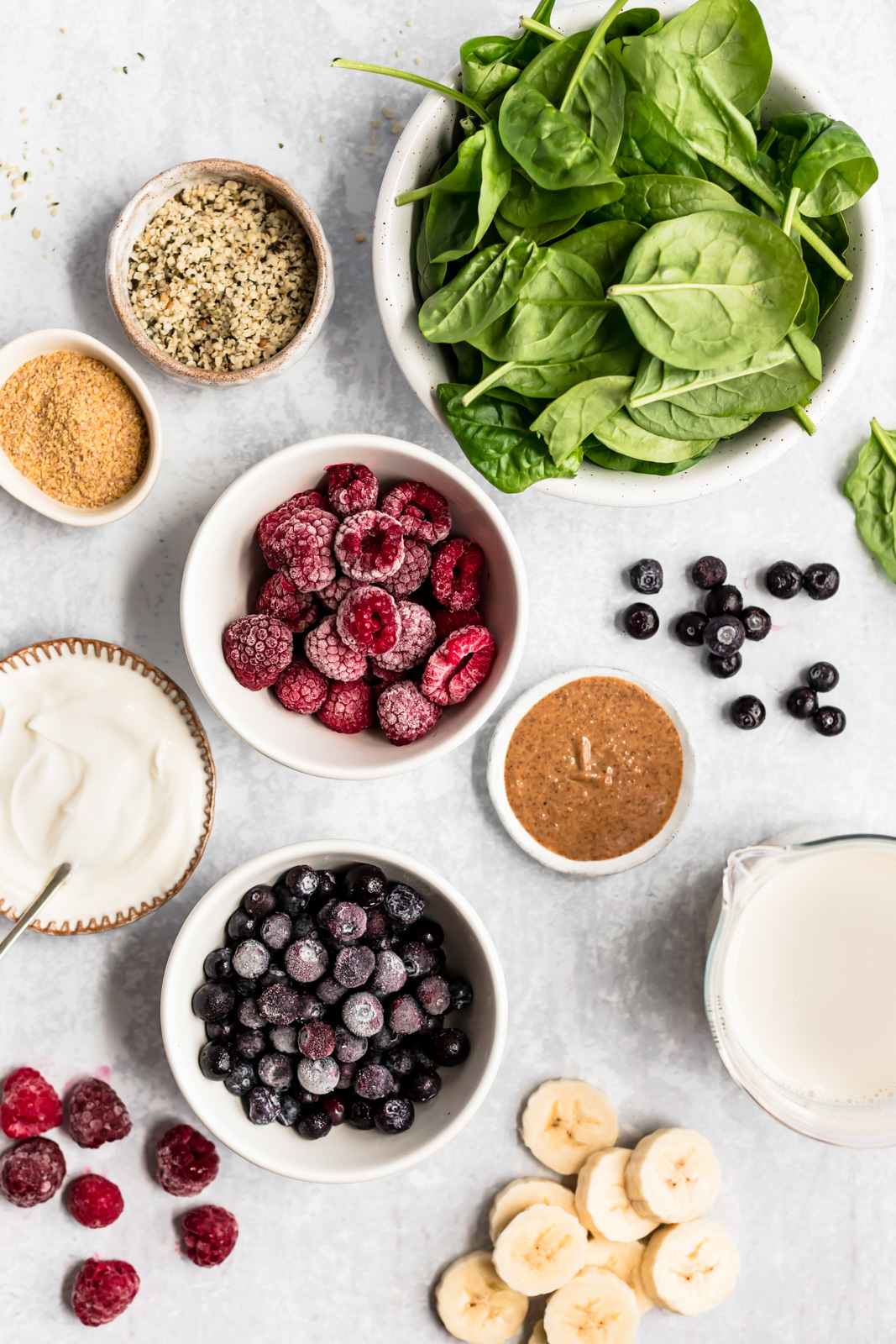 ingredients for a berry smoothie in bowls