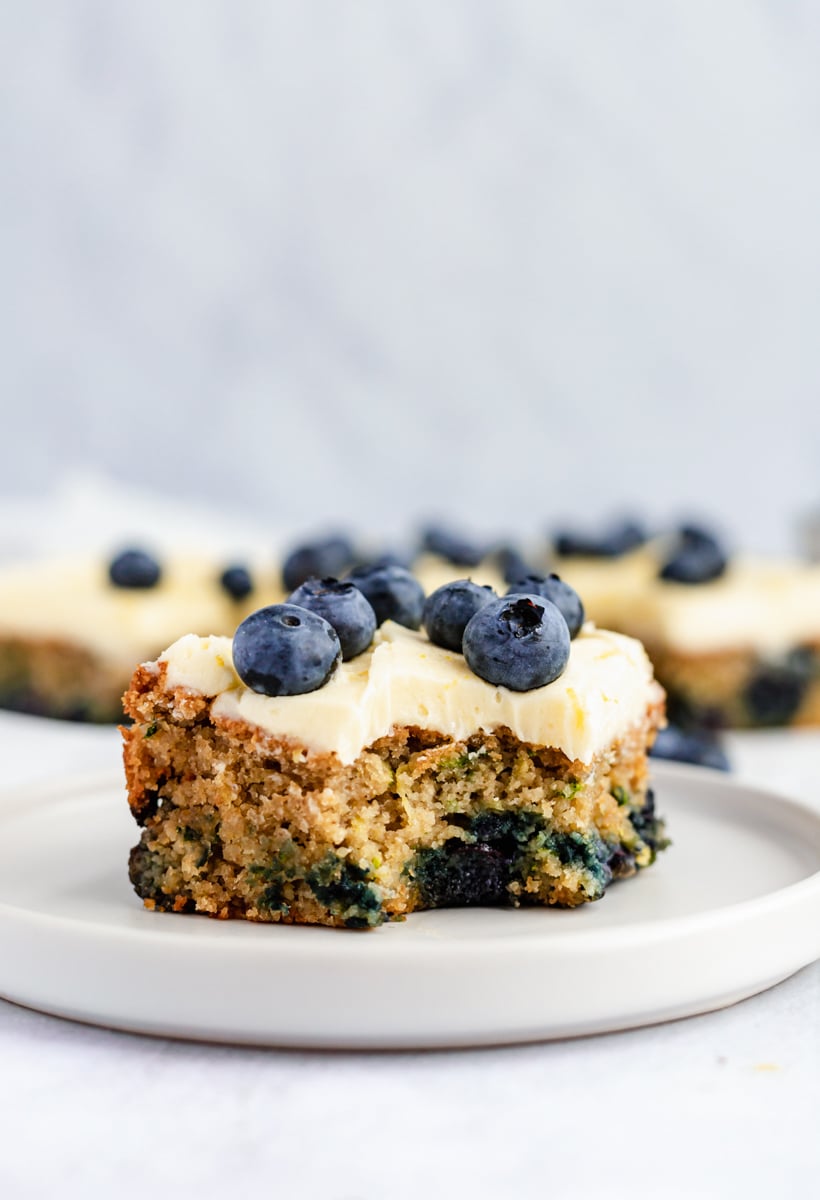 slice of gluten free blueberry zucchini cake on a plate