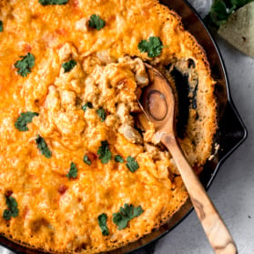 white bean buffalo dip in a skillet with a spoon