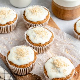 healthy carrot cake muffins on a wooden board