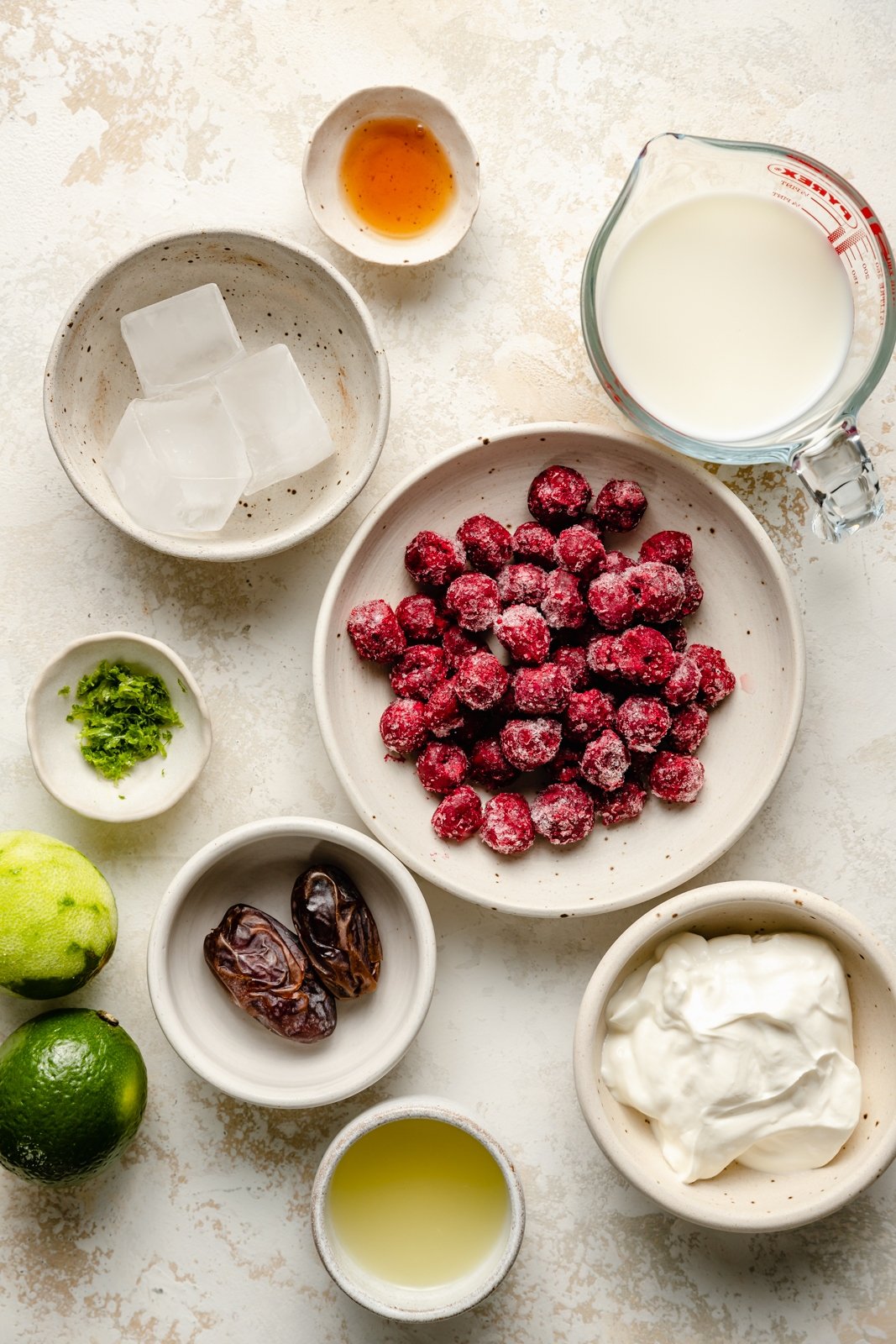 ingredients for a cherry lime smoothie in bowls