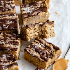 coconut chocolate protein bars on parchment paper