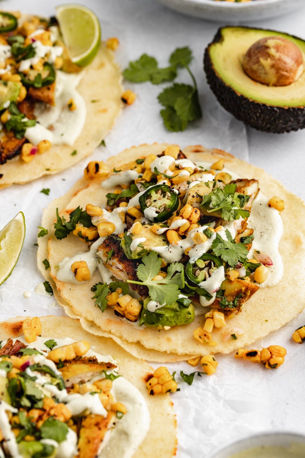 street corn chicken taco on parchment paper