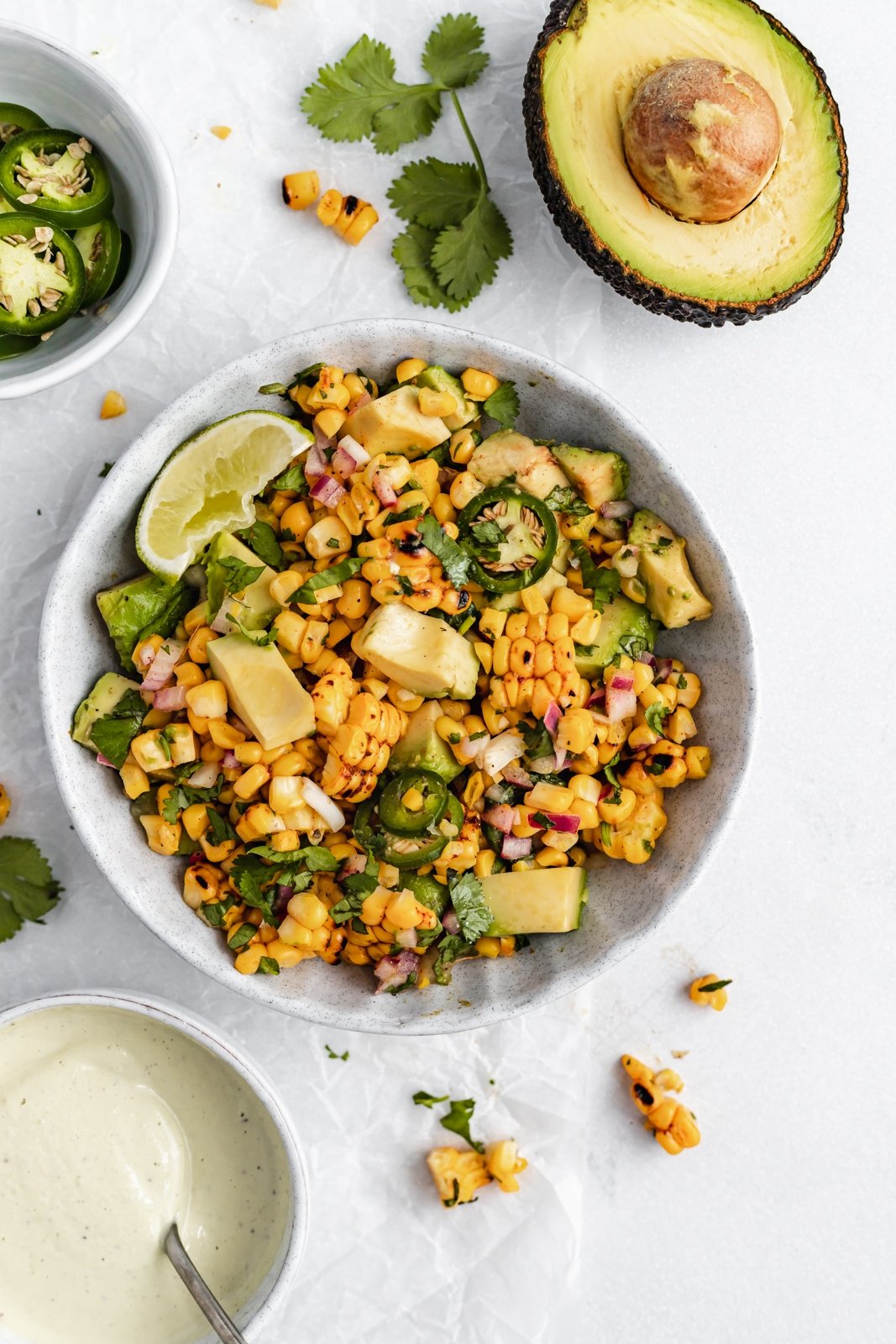 grilled street corn avocado salsa in a bowl