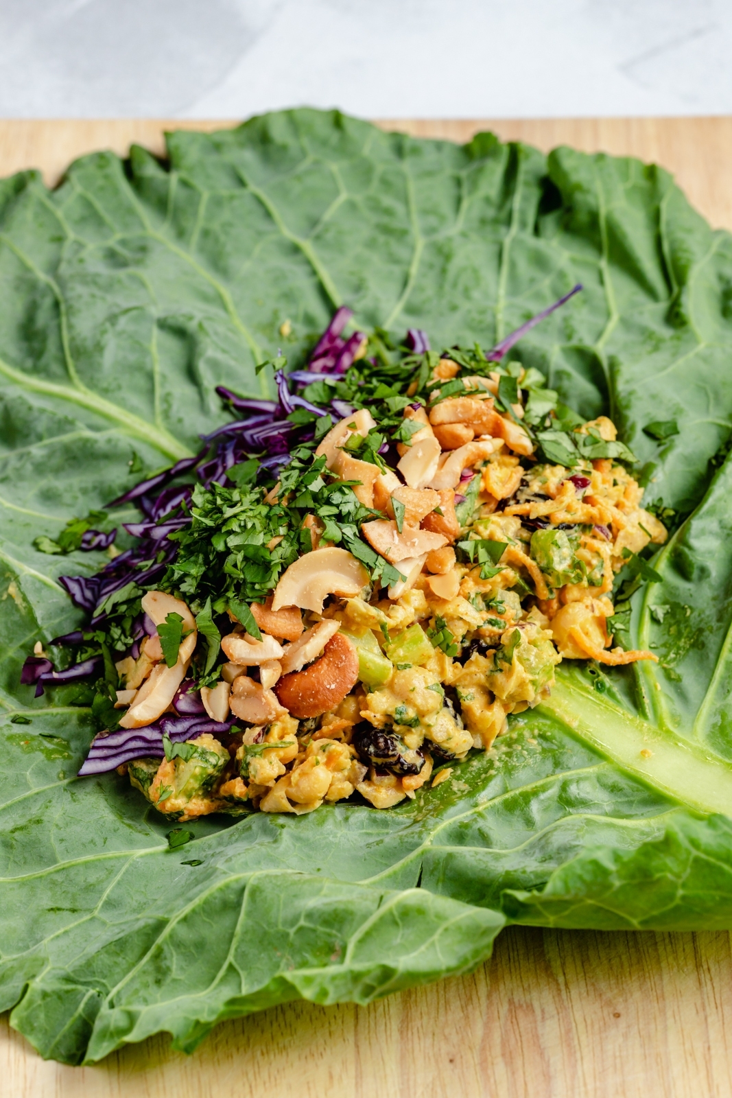 curry chickpea salad on top of a collard leaf