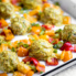healthy chicken meatballs with coconut curry sauce and bell peppers