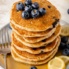 stack of lemon blueberry pancakes on a plate