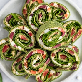 greek salad pinwheels on a platter