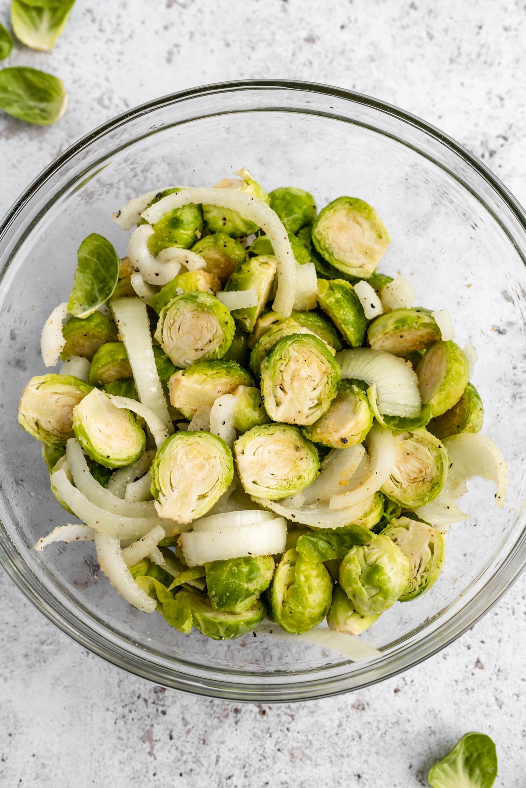 brussels sprouts and yellow onion in a bowl