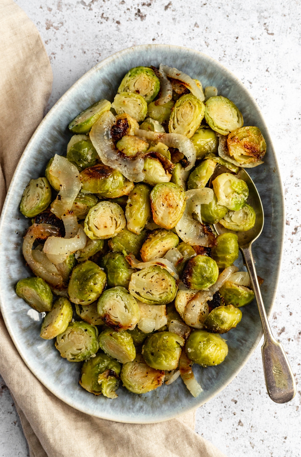 easy grilled brussels sprouts in a dish with a spoon