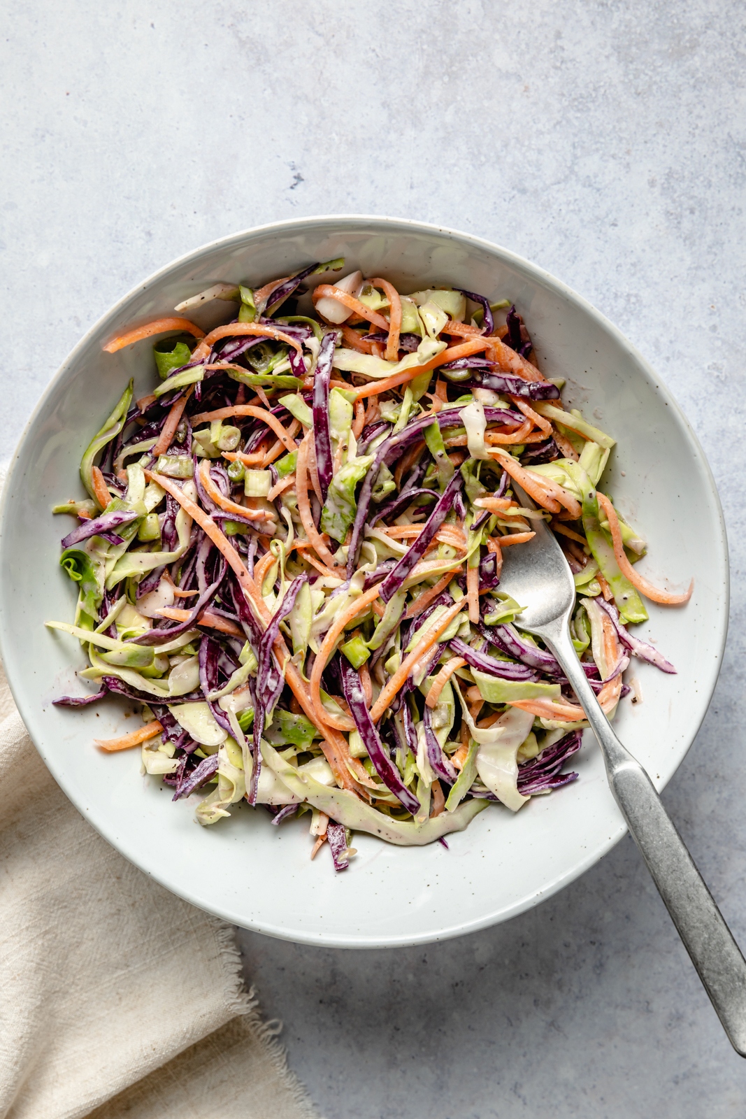 tahini slaw in a bowl for chicken caesar sandwiches