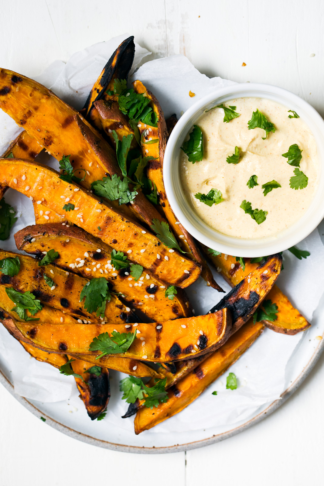 easy grilled sweet potato fries on a plate with dip