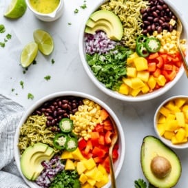 vegan green rice burrito bowls next to an avocado