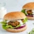moroccan-inspired turkey burger topped with feta sauce, lettuce and red onion