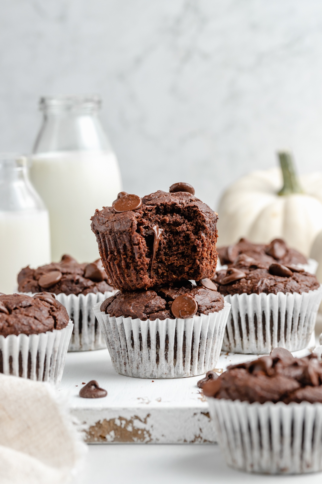 chocolate pumpkin muffins in a stack