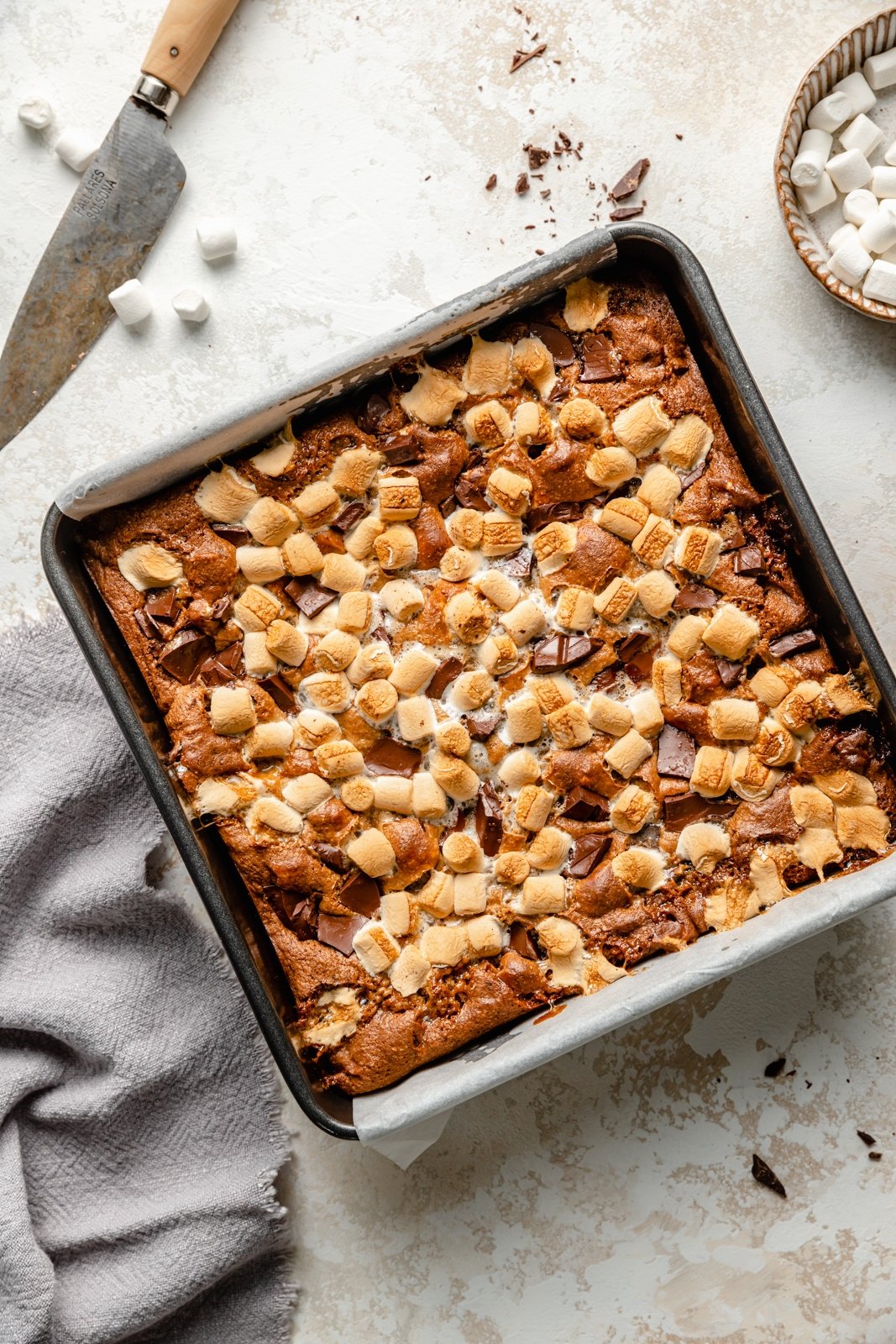 tahini s'mores cookie bars in a baking pan