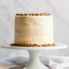 healthy gluten free carrot cake on a cake stand