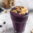 vegan peanut butter blueberry banana smoothie in a glass