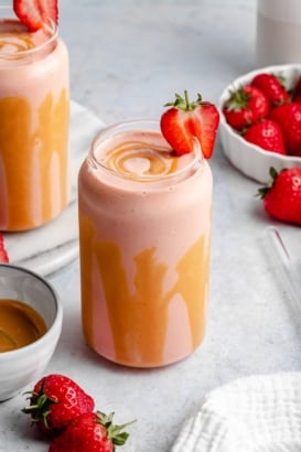 peanut butter strawberry banana smoothie in a glass