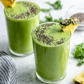 two pineapple kale smoothies in glasses