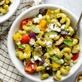 roasted vegetable pasta in a bowl with goat cheese