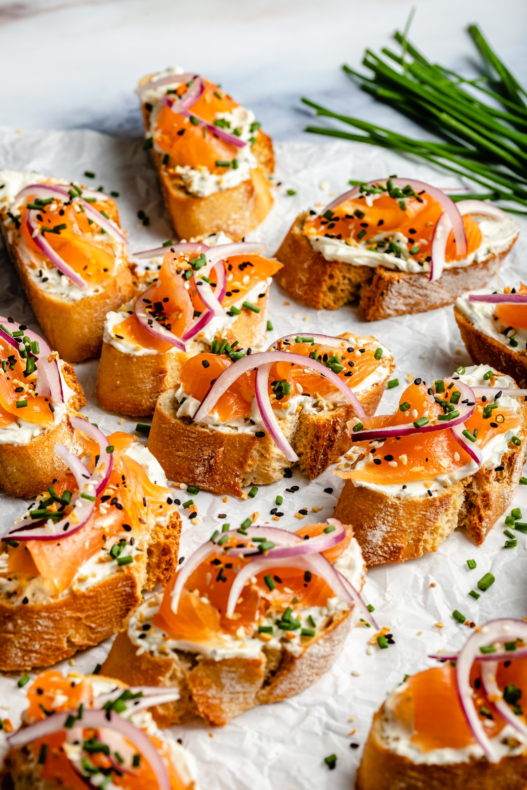 healthy smoked salmon crostini on parchment paper