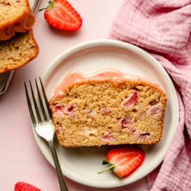 slice of healthy strawberry bread on a plate with a fork