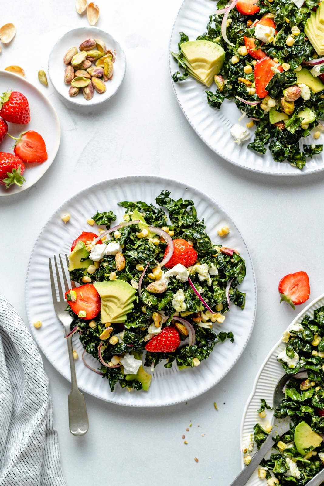 summer strawberry kale salad on two plates