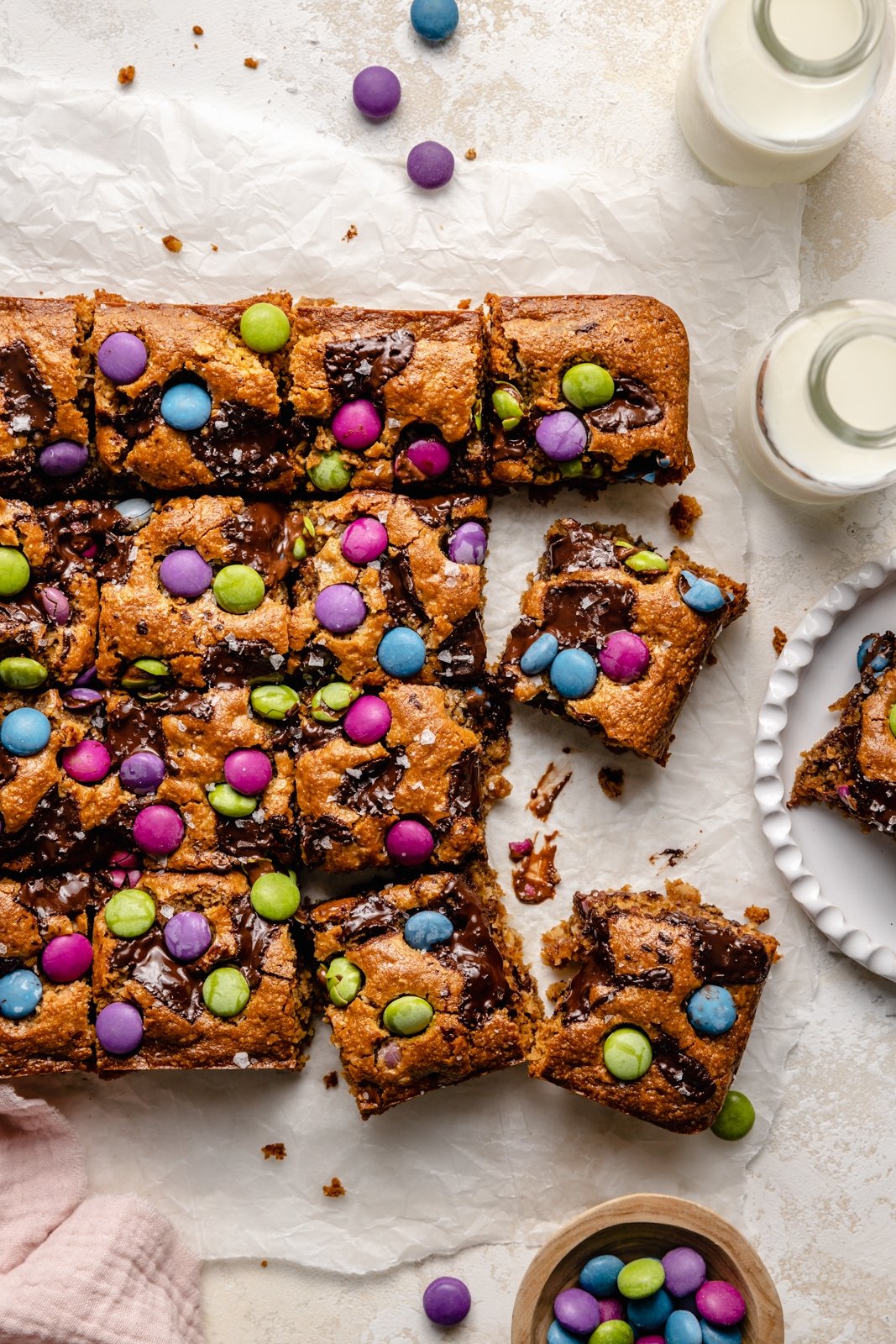 monster cookie bars sliced on parchment paper