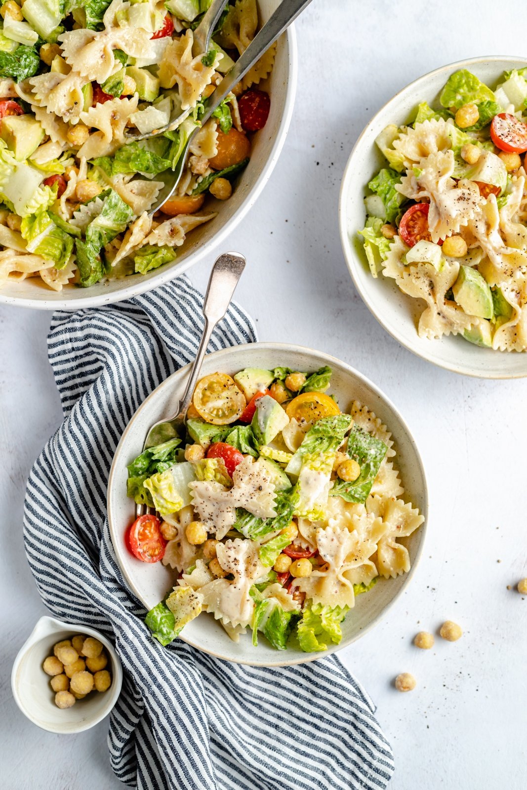 vegan caesar pasta salad in bowls