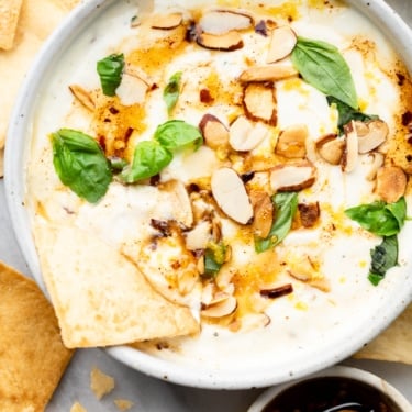 whipped feta dip with garnishes in a bowl