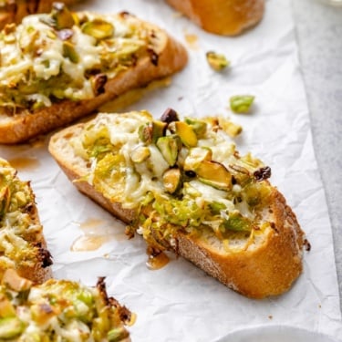 cheddar brussels sprouts crostini on parchment paper